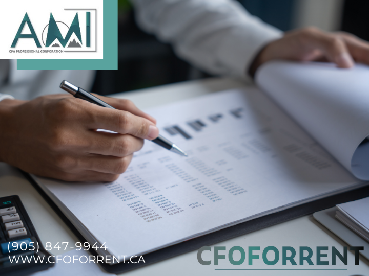 A.M.I. CPA Professional Corporation logo in the top left corner over a picture of a hand holding a pen, flipping corporate financial papers on a desk.