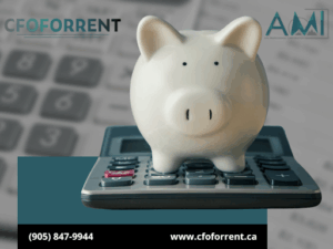 White piggy bank on top of a calculator with papers and another calculator in the background, and the A.M.I. CPA Professional Corporation logo in the top right corner and the CFOFORRENT in the top left corner.