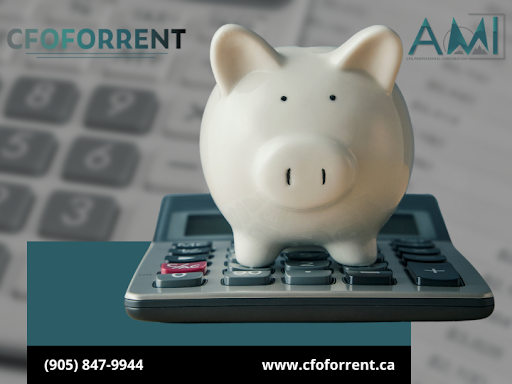 White piggy bank on top of a calculator with papers and another calculator in the background, and the A.M.I. CPA Professional Corporation logo in the top right corner and the CFOFORRENT in the top left corner.