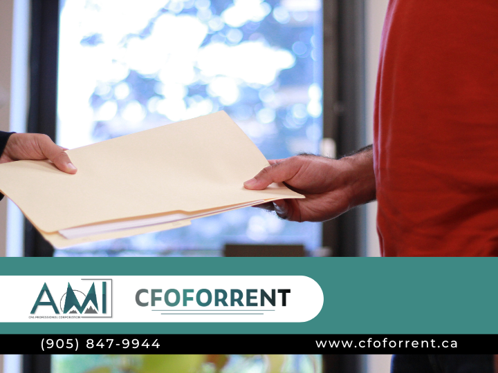 AMI, CPA Professional Corporation branded image with two men exchanging a corporate tax file.