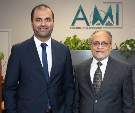 Ahmad and Mumtaz from A.M.I. CPA Professional Corporation inside their accounting firm that serves Oakville and The GTA.