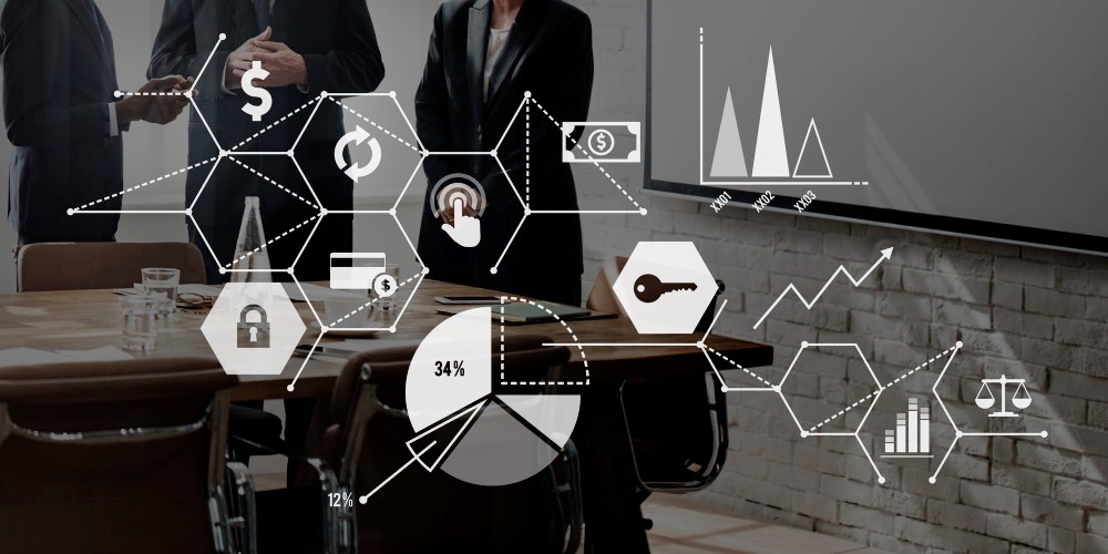 People meeting in a board room with graphs and analytics and icons representing business growth and goals with the incorporation of a fractional CFO.